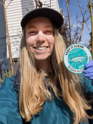 Sally Ehlers, blonde woman in dark billed cap